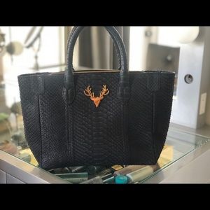 PYTHON TOTE WITH SIGNATURE ORANGE SUEDE LINING.